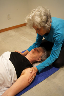 Focusing on alignment of head, neck and shoulders in supine position