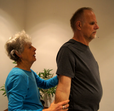Awareness of arm and shoulder position helps improving posture a) and b)